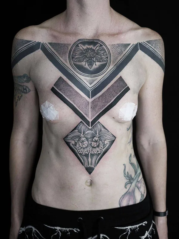 female black geometric tattoo on chest #31027 | Tattoo Artist Maxime Plescia-Buchi