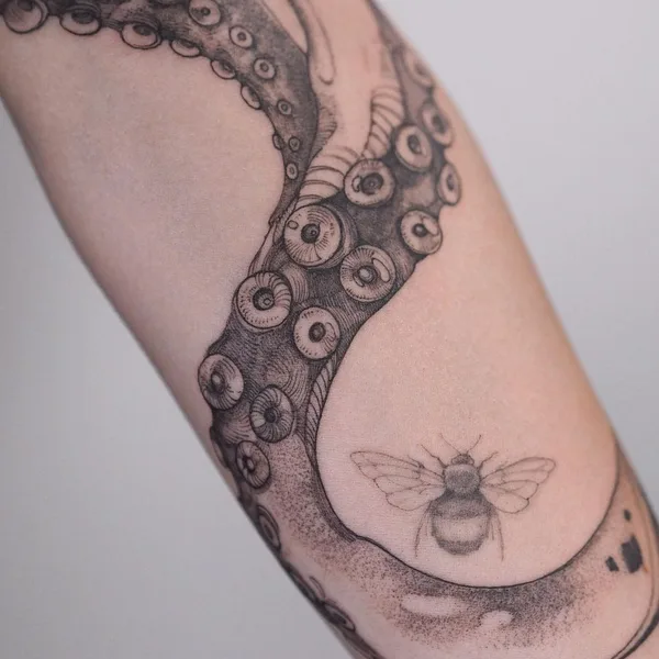 Graphic tattoo by Полина Матвеева in Saint Petersburg