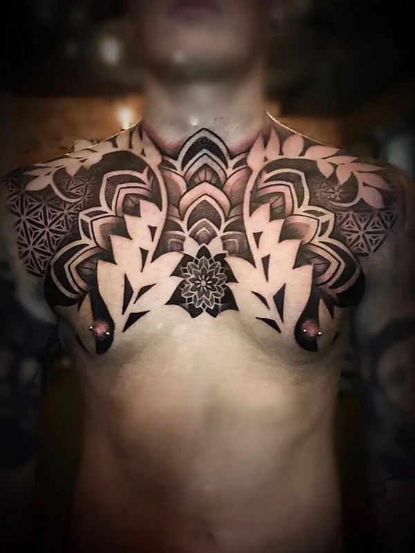 male black and grey ornamental tatouage sur chest #31610 | Artiste tatoueur John Del-Pinto