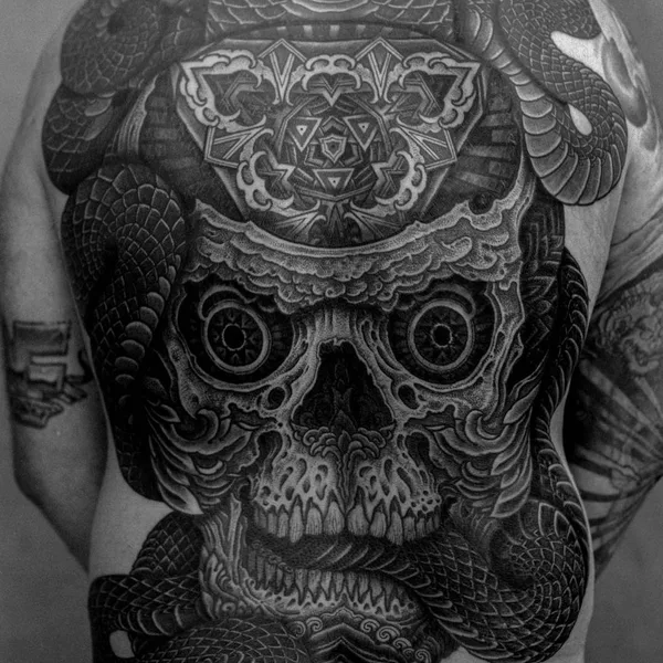 Ornamental tattoo by Thomas Hooper in County of East Sussex