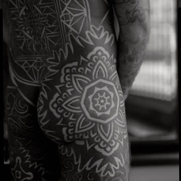 Ornamental tattoo by Thomas Hooper in County of East Sussex