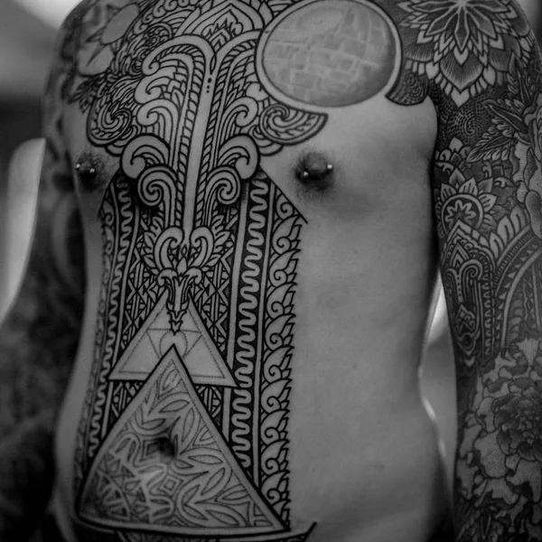 Ornamental tattoo by Thomas Hooper in County of East Sussex
