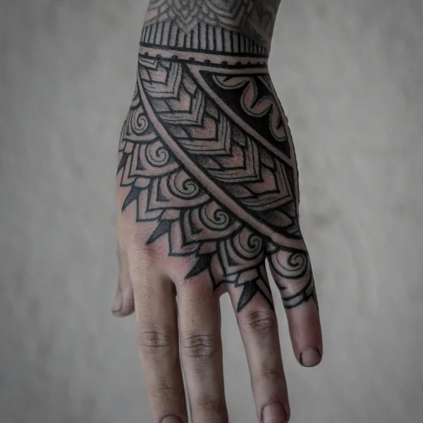Ornamental tattoo by Thomas Hooper in County of East Sussex