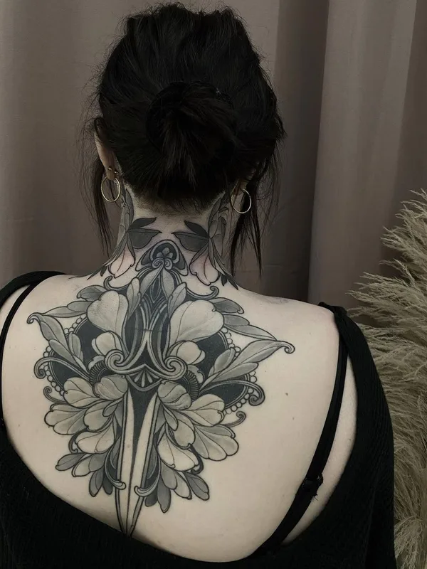 female black and grey ornamental tattoo on upper back #54277 | Tattoo Artist Georg Faust