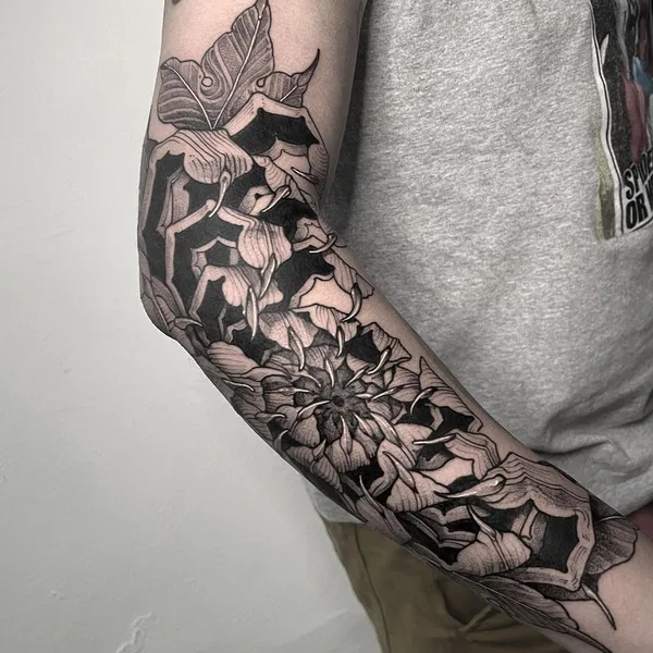 Graphic tattoo by Erick Cuevas in Guadalajara