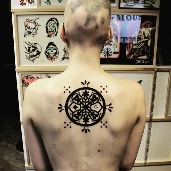 Ornamental tattoo by Candice Soleillant in Essertines-en-Châtelneuf