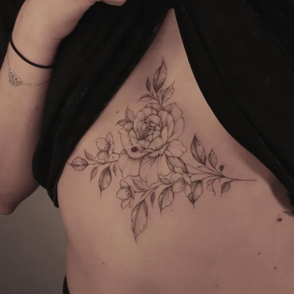 Feminine tattoo by Krysz in Wrocław