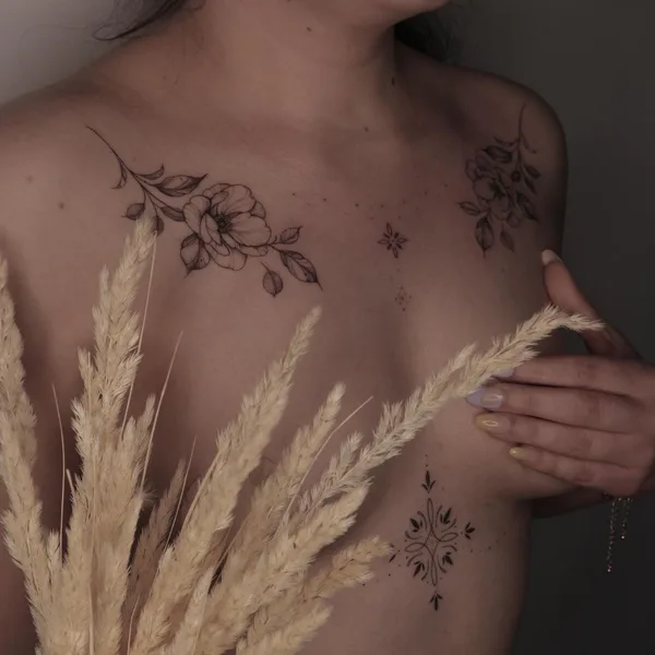 Feminine tattoo by Krysz in Wrocław