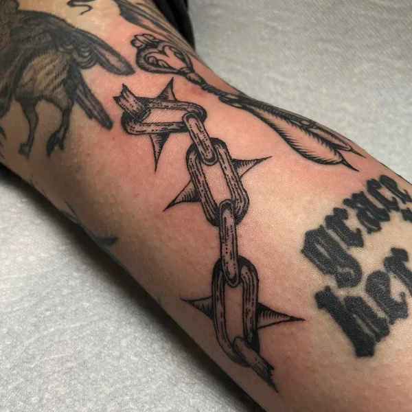 Graphic tattoo by Mackenzie in Düsseldorf