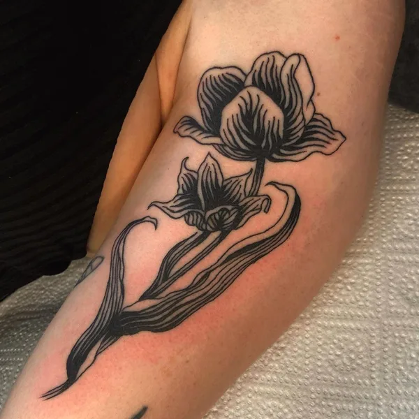 Graphic tattoo by Mackenzie in Düsseldorf