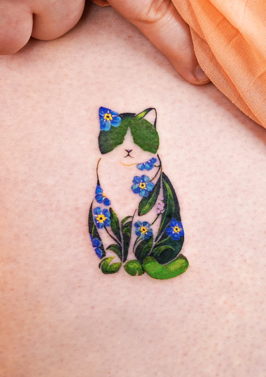 Tatuaggio miniaturizzato di gatto