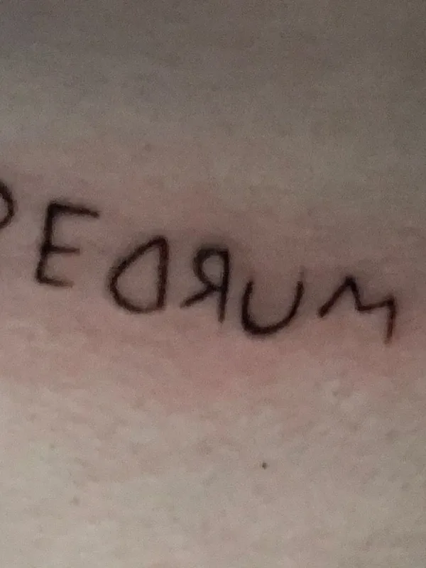 black lettering tattoo on back of neck #40560 | Tattoo Artist Salem Schaar