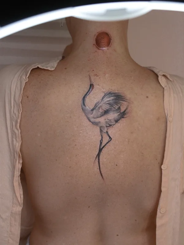 female black and grey sketch tattoo on upper back #58343 | Tattoo Artist Юлия Гришанок