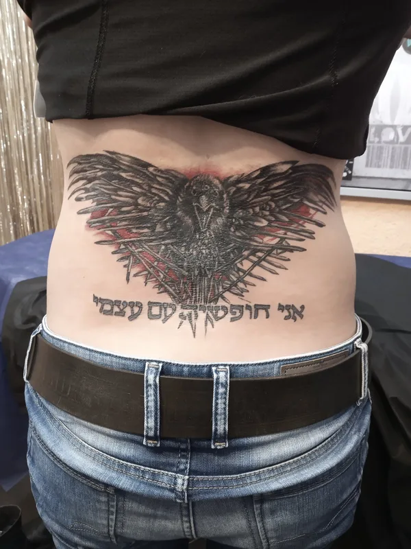 black and grey blackwork татуировка на lower back #34929 | Тату мастер Roman Sniatovskyi