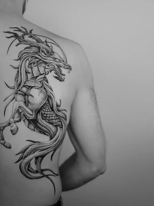 Graphic tattoo by Ezer in Paris