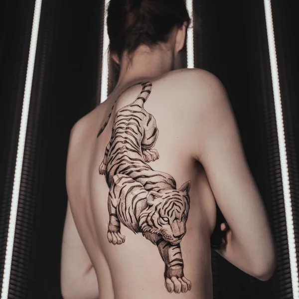Graphic tattoo by Ezer in Paris