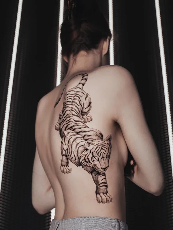 Graphic tattoo by Ezer in Paris