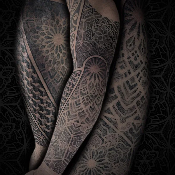 Ornamental tattoo by Jean Pierre Mottin in Liège