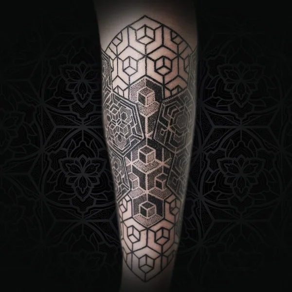 Ornamental tattoo by Jean Pierre Mottin in Liège