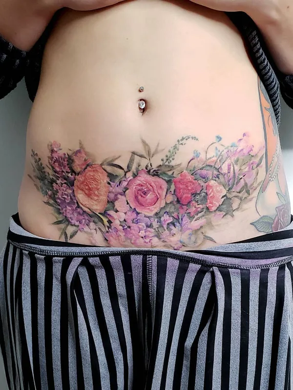 female color watercolor Tatuaggio su stomach #31240 | Tatuatore Pete Zebley