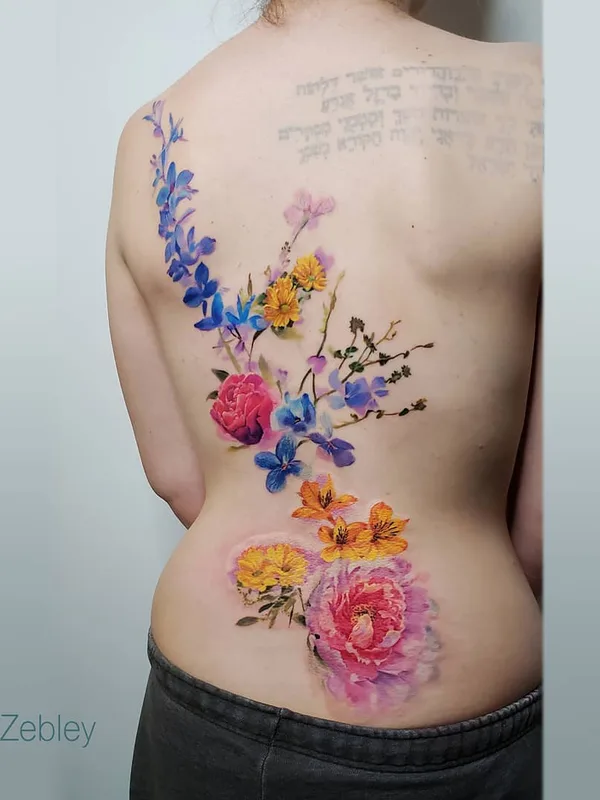 female color watercolor Tatuaggio su lower back #31237 | Tatuatore Pete Zebley