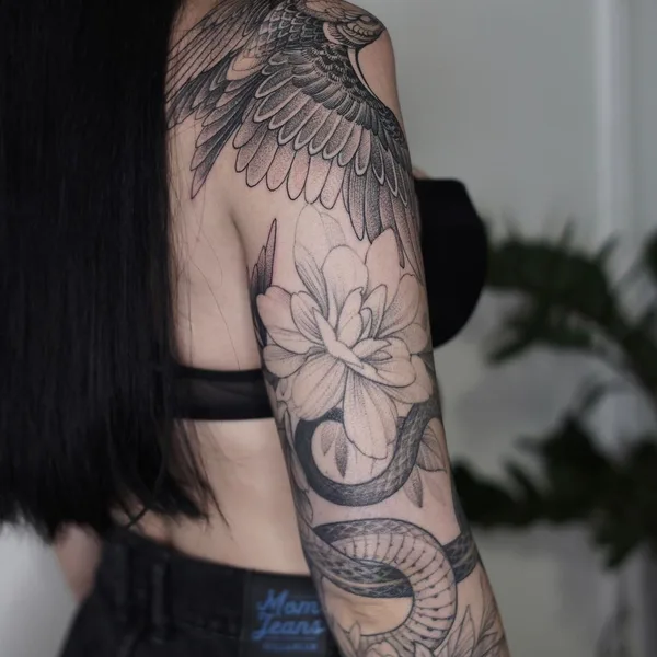 Graphic tattoo by Sasha Tabuns in Saint Petersburg