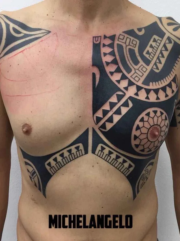 male black tribal tattoo on chest #14584 | Tattoo Artist Michelangelo