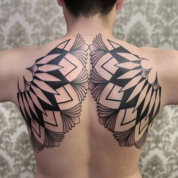 Ornamental tattoo by Chaim Machlev in Berlin