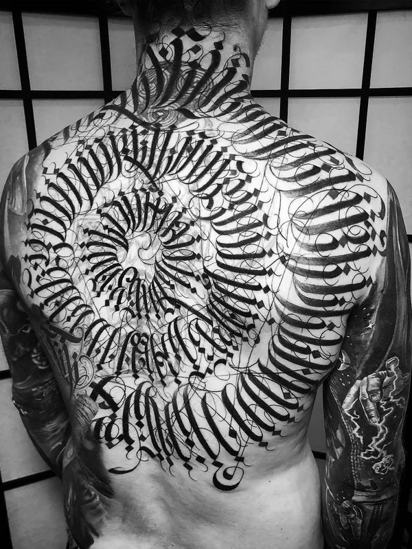 black and grey calligraphy tattoo on full back #29521 | Tattoo Artist MAYONAIZE