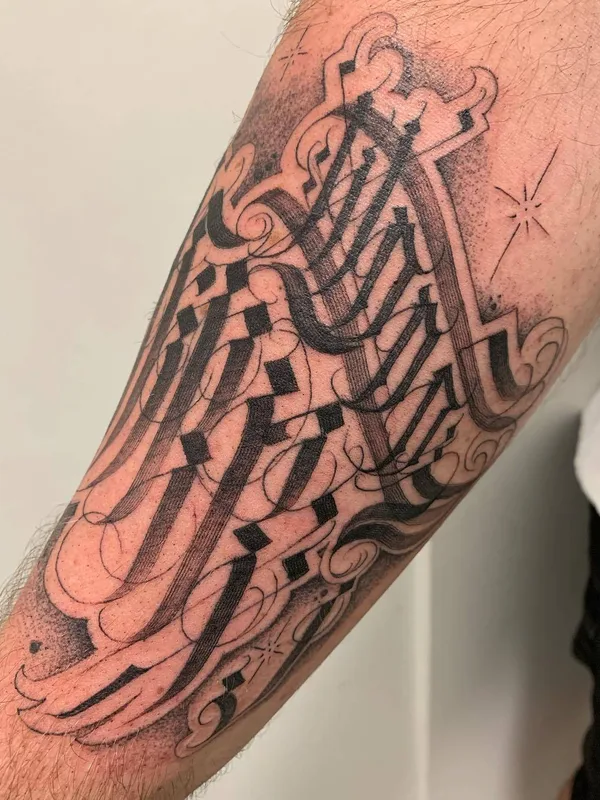 black calligraphy tattoo on forearm #29527 | Tattoo Artist MAYONAIZE