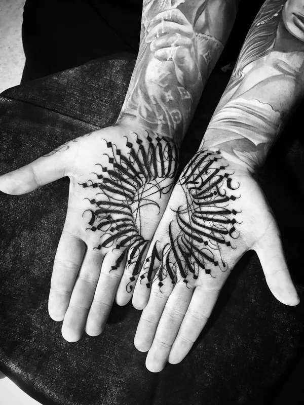 black calligraphy tattoo on palm #29522 | Tattoo Artist MAYONAIZE