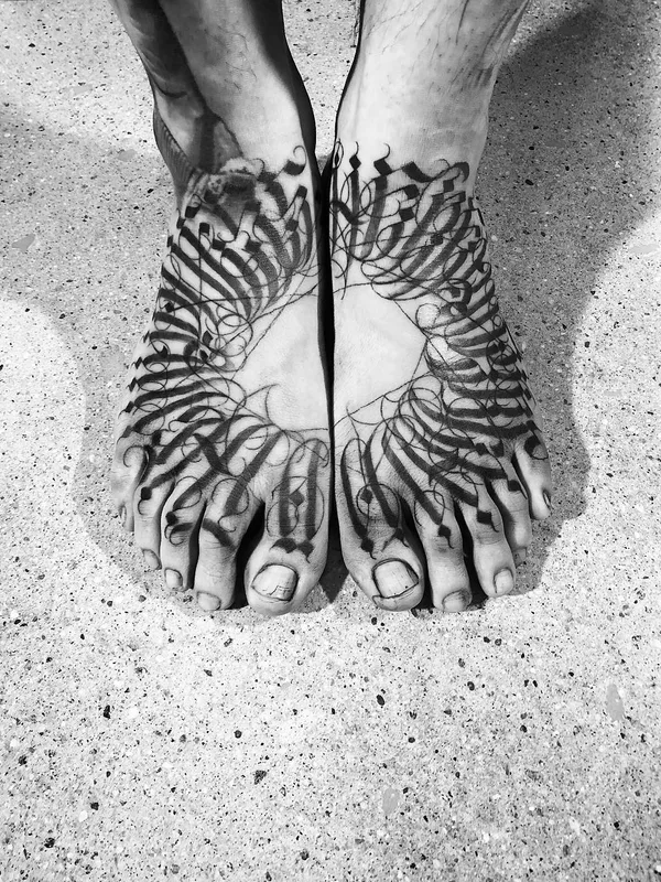 black and grey calligraphy tattoo on foot #29530 | Tattoo Artist MAYONAIZE