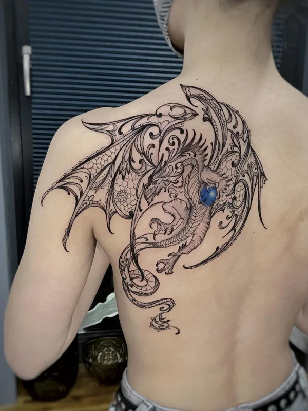female black and grey ornamental tattoo on upper back #45897 | Tattoo Artist Елена Баски