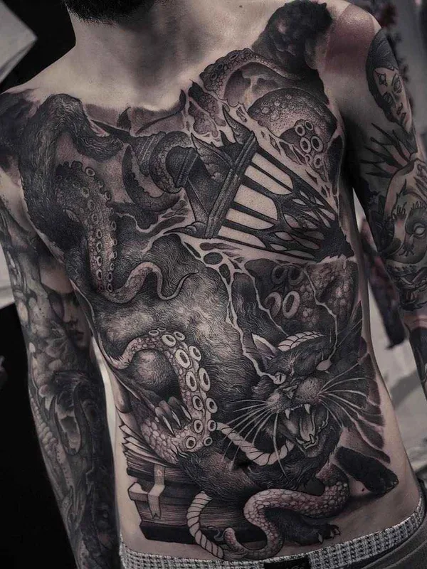 male black and grey blackwork tattoo on chest #8931 | Tattoo Artist Rob Borbas