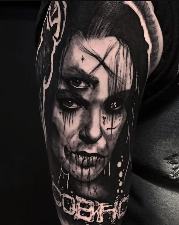female black and grey blackwork tattoo on upper arm #66953 | Tattoo Artist Jyrke Savolainen