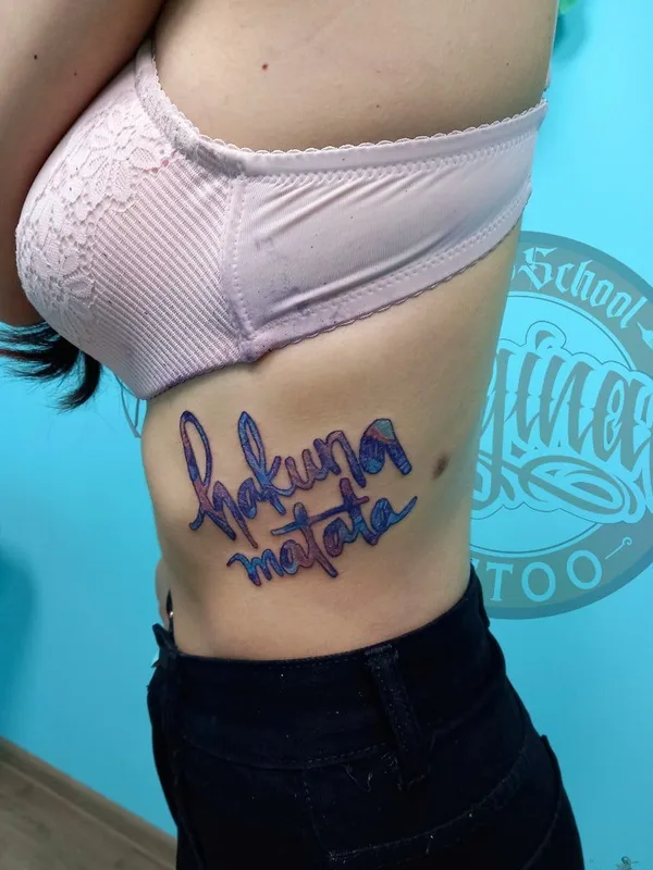female color lettering татуировка на ribcage #39672 | Тату мастер Сергей Копылов