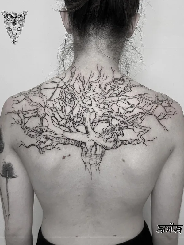 female black linework tattoo on upper back #57209 | Tattoo Artist Anita Rossi