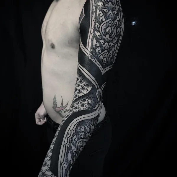 Graphic tattoo by Diamante Murru in Berlin