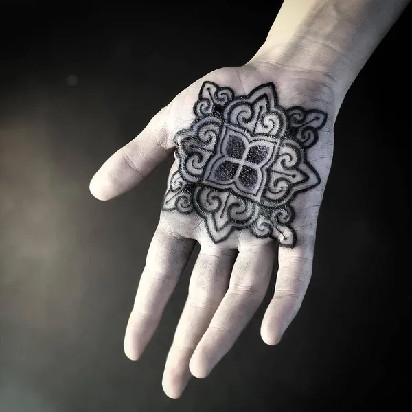 Graphic tattoo by Diamante Murru in Berlin