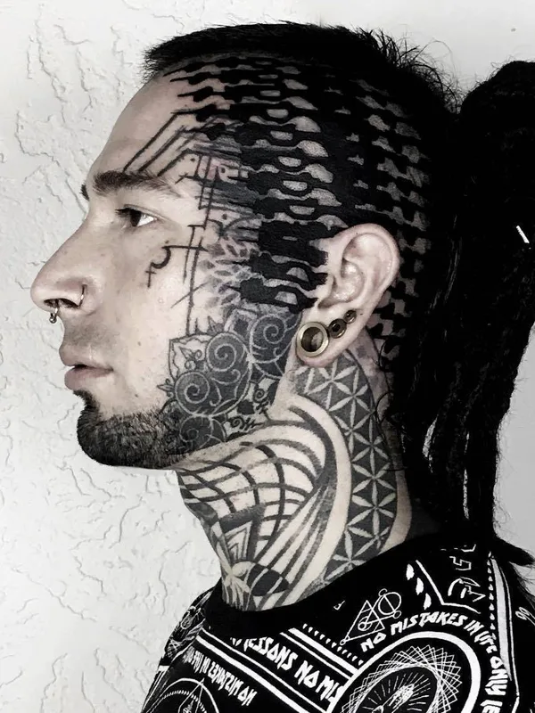male black blackwork tattoo auf face #29625 | Tätowierer Byron