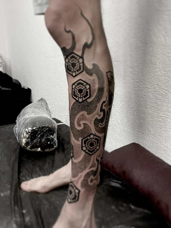 black and grey geometric tattoo on calf #45989 | Tattoo Artist Никита Шероухов