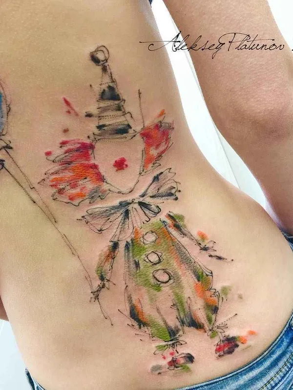 female color watercolor tattoo on lower back #12812 | Tattoo Artist Алексей Платунов