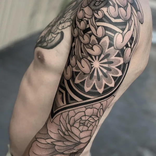 Graphic tattoo by Zach Donn in Denver