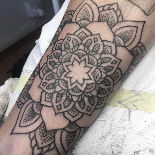 Ornamental tattoo by Jon James Case in Wilderness