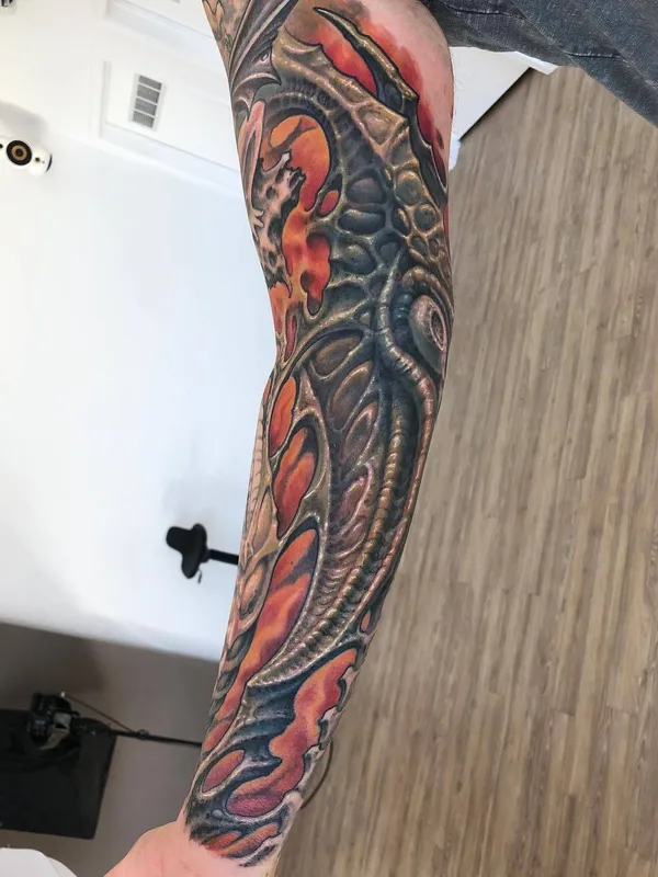 color biomechanical tattoo on full sleeve #29209 | Tattoo Artist Guy Aitchison