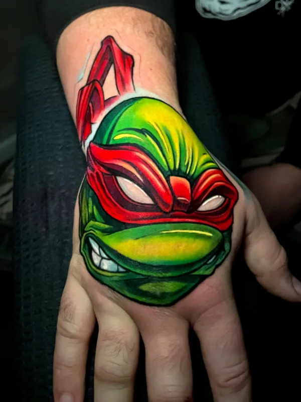 color cartoon tatuaje en hand #73178 | Tatuador Kate Perets