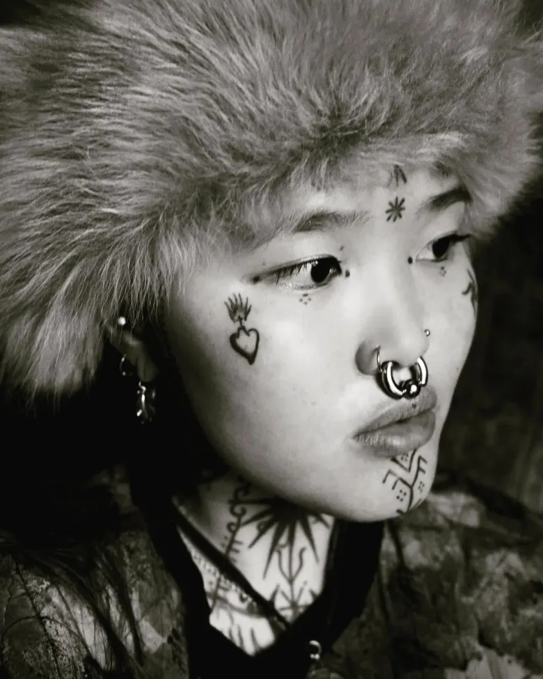 Girl with face tattoos Candice Soleillant
