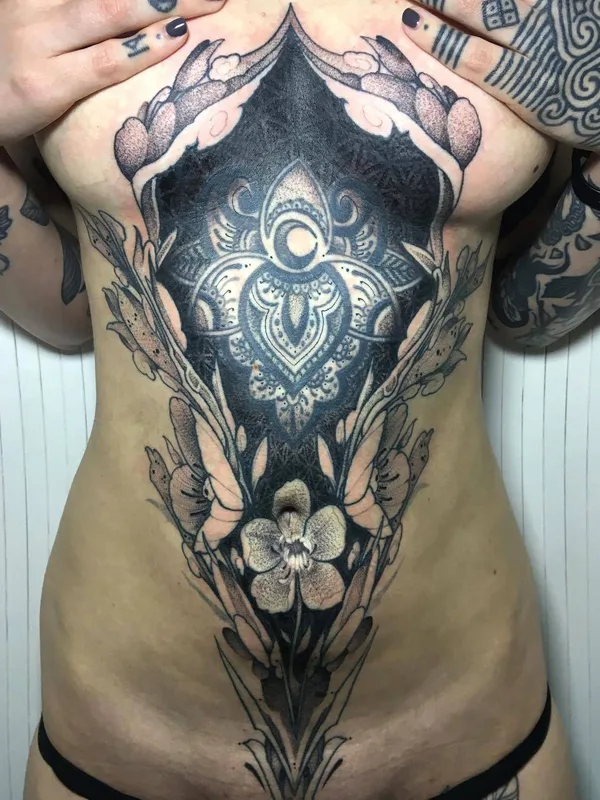 female black and grey ornamental татуировка на sternum #34632 | Тату мастер Raphcemo