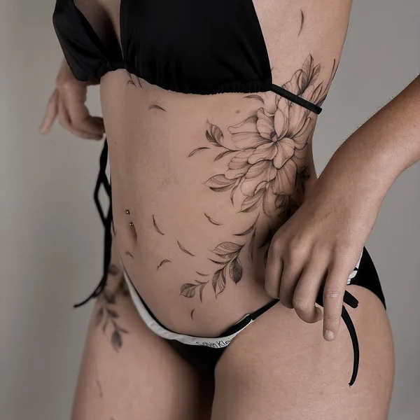 Feminine tattoo by Nicazky in Zürich