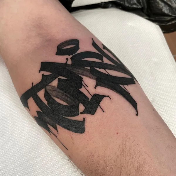 Calligraphy tattoo by Dustin | DESUR in Hamburg